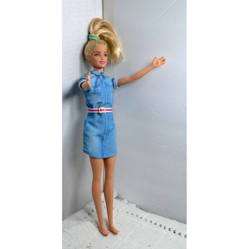 Barbie Dreammhouse adventures doll in a denim shirt dress with pink and white be